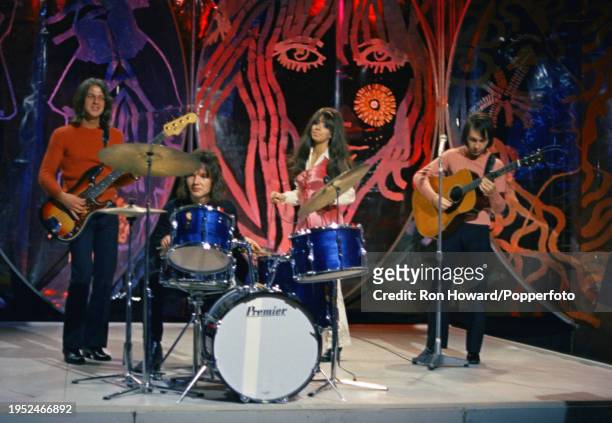 Dutch rock group Shocking Blue perform on the set of a pop music television show in London circa 1970. Members of the band are, from left, bassist...