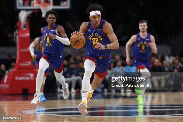 Zeke Nnaji of the Denver Nuggets dribbles against the Washington Wizards during the first half at Capital One Arena on January 21, 2024 in...
