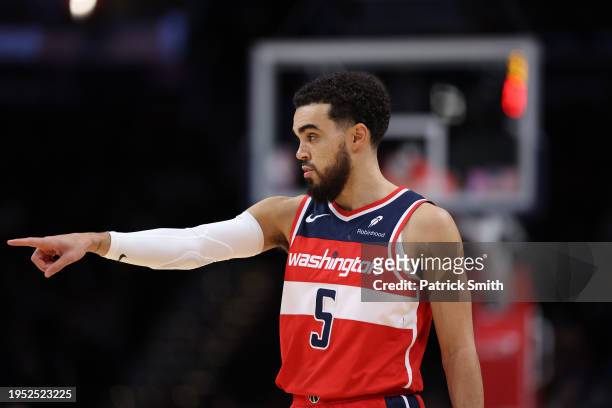Tyus Jones of the Washington Wizards looks on against the Denver Nuggets during the second half at Capital One Arena on January 21, 2024 in...
