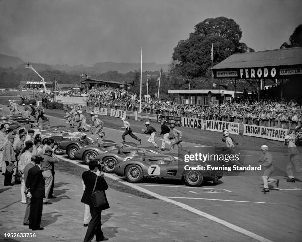 Drivers running toward their cars to start the RAC Tourist Trophy race at Goodwood Circuit, Sussex, September 13th 1958.