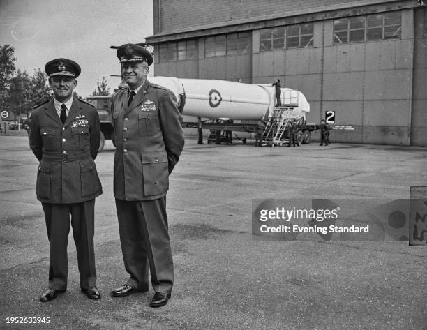 Major General William H Blanchard of the US Air Force and Air Vice Marshal Kenneth Cross of the RAF observe delivery of the first PGM-17 Thor...