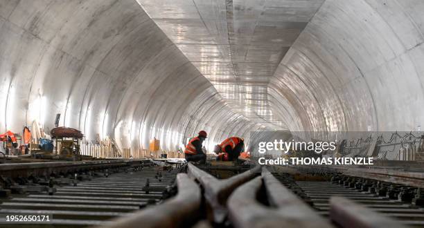 Trackmen work on the rails leading to the new underground main station of the railway development project Stuttgart 21 in Stuttgart, southwestern...