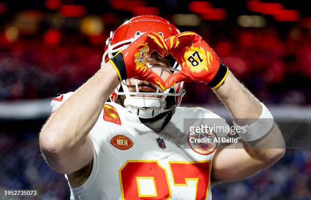 Travis Kelce of the Kansas City Chiefs celebrates after scoring a 22 yard touchdown against the Buffalo Bills during the second quarter in the AFC...
