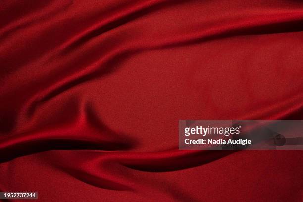 draped red silk background - draped silk stock pictures, royalty-free photos & images