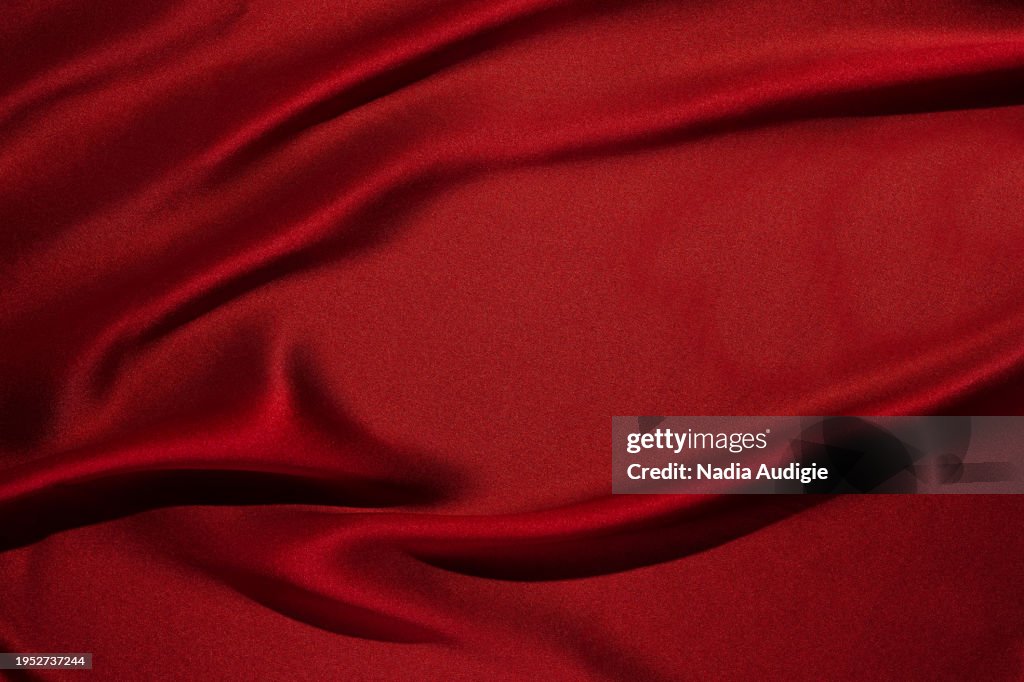 Draped red silk background