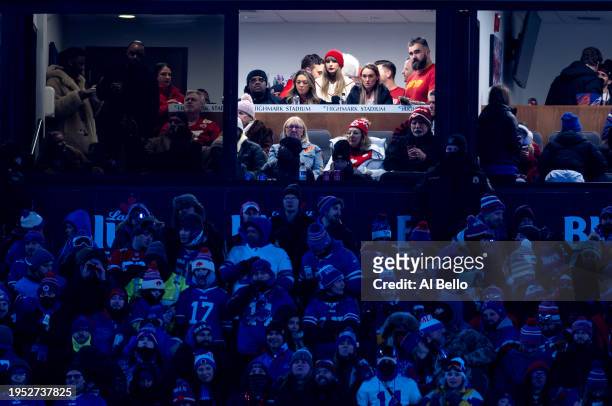Singer-songwriter Taylor Swift and Jason Kelce of the Philadelphia Eagles watch the AFC Divisional Playoff between the Kansas City Chiefs and the...