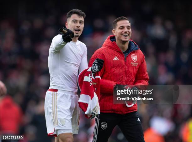 Gabriel Martinelli and Cedric Soares of Arsenal share a joke after the Premier League match between Arsenal FC and Crystal Palace at Emirates Stadium...