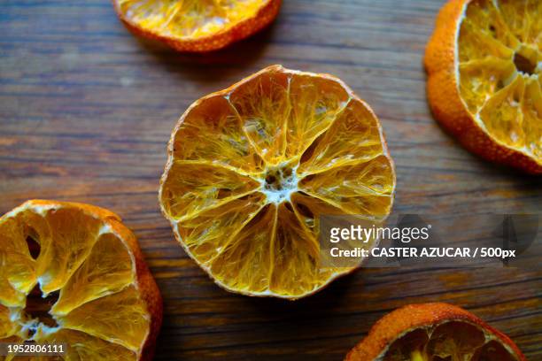 high angle view of orange slices on table - azucar stock pictures, royalty-free photos & images