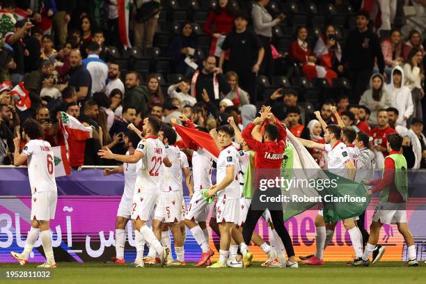 Tajikistan players celebrate with the fans after the team's victory during the AFC Asian Cup Group A match between Tajikistan and Lebanon at Jassim...