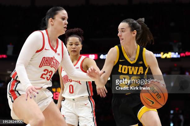 Caitlin Clark of the Iowa Hawkeyes is defended by Rebeka Mikulasikova of the Ohio State Buckeyes during the game at Value City Arena on January 21,...