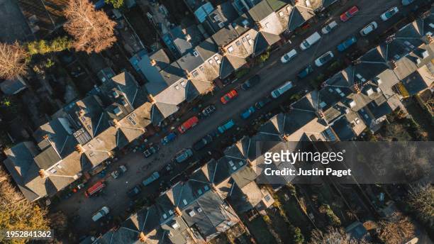 drone/aerial view over a street of victorian terraced houses in the uk - cambridge uk aerial stock pictures, royalty-free photos & images