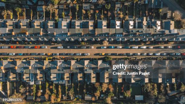 drone/aerial view over a street of victorian terraced houses in the uk - cambridge uk aerial stock pictures, royalty-free photos & images