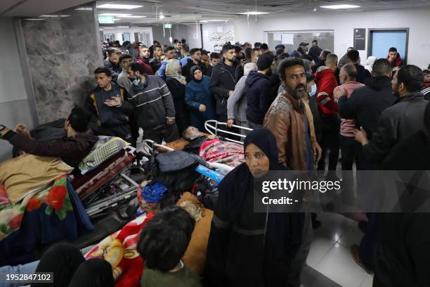 Injured people receive treatment in Gaza City's Al-Shifa hospital, following a reported Israeli strike, that according to Gaza's Health Ministry,...