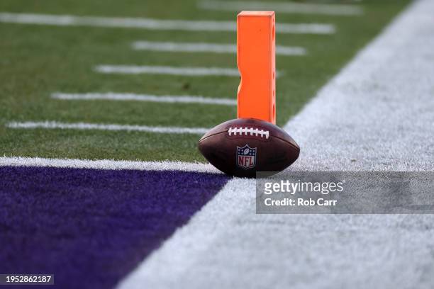 Football sits by a pylon before the start of the Baltimore Ravens and Houston Texans AFC Divisional Playoff game at M&T Bank Stadium on January 20,...