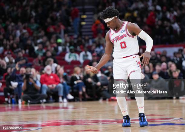 Aaron Holiday of the Houston Rockets reacts after sinking a three-point shot during the game against the Boston Celtics at Toyota Center on January...