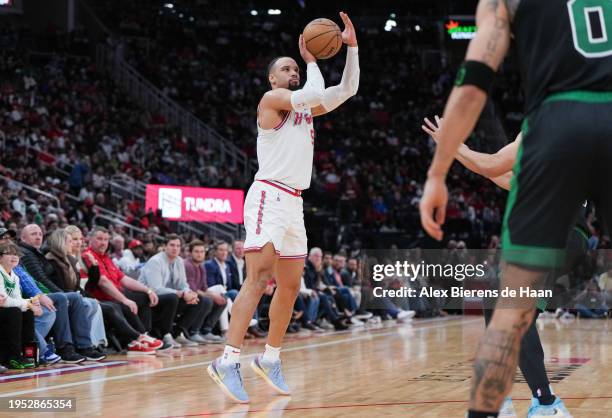 Dillon Brooks of the Houston Rockets attempts a three-point shot during the game against the Boston Celtics at Toyota Center on January 21, 2024 in...