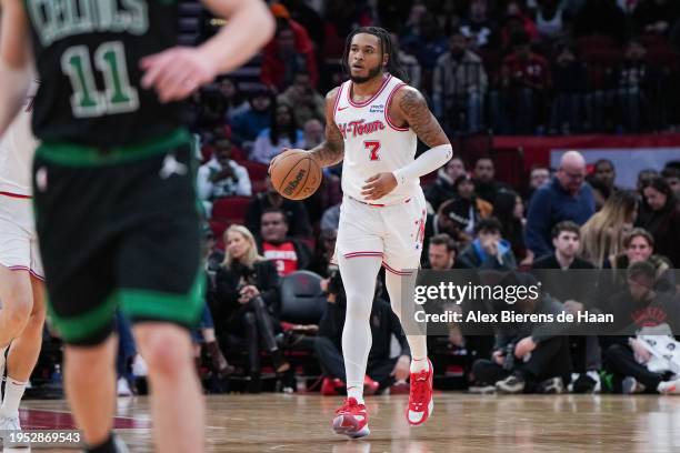 Cam Whitmore of the Houston Rockets dribbles the ball during the game against the Boston Celtics at Toyota Center on January 21, 2024 in Houston,...