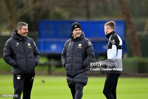Assistant 1st Team Coach Miguel D'Agostino, Head Coach Mauricio Pochettino and Cole Palmer of Chelsea during a training session at Chelsea Training...