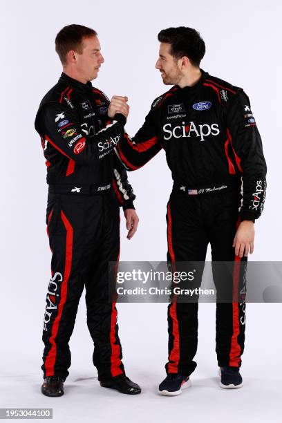 Driver Ryan Sieg and CJ McLaughlin pose for a photo during NASCAR Production Days at the Charlotte Convention Center on January 17, 2024 in...