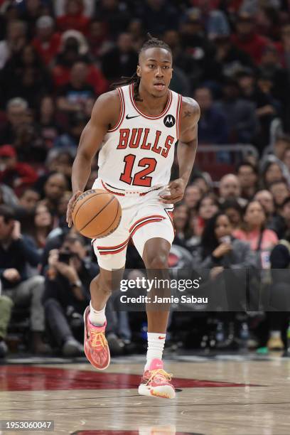 Ayo Dosunmu of the Chicago Bulls controls the ball against the Memphis Grizzlies on January 20, 2024 at United Center in Chicago, Illinois. NOTE TO...