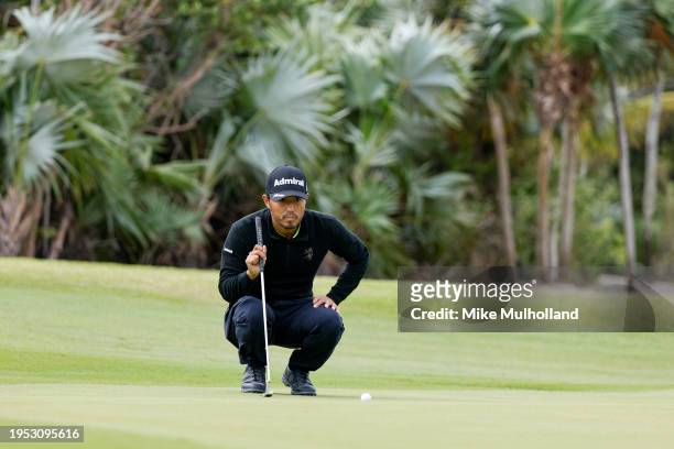 Satoshi Kodaira of Japan looks over a putt on the 13th hole during the second round of The Bahamas Great Abaco Classic at The Abaco Cub on January...