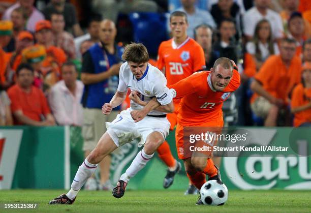 June 21: Dmitri Torbinski of Russia and Wesley Sneijder of Netherlands challenge during the UEFA Euro 2008 Quarter Final match between Netherlands...