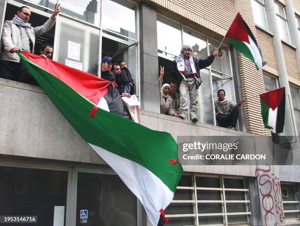 Some 40 People occupy the Belgian Red Cross headquarters in Brussels 09 April 2002, to protest 'the negative and passive attidude of the...