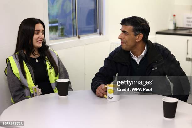 Britain's Prime Minister Rishi Sunak speaks to construction trainees at the Construction Skills Village on January 25, 2024 in Eastfield, near...