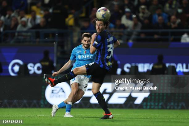 Khvicha Kvaratskhelia of SSC Napoli takes a shot whilst under pressure from Matteo Darmian of FC Internazionale during the Italian EA Sports FC...