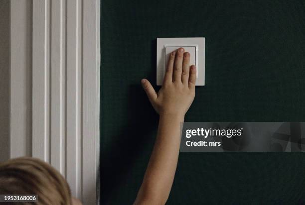 switching lights - schakelaar stockfoto's en -beelden