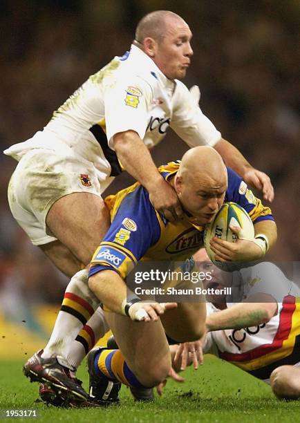 Danny Ward of Leeds Rhinos is tackled by the Bradford defence during the Powergen Challenge Cup Final 2003 match between Bradford Bulls and Leeds...