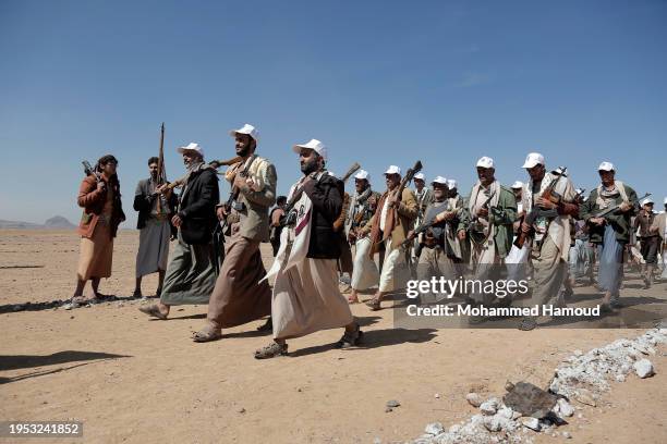 Yemen's Houthi followers take part in a tribal parade held against the United States-led aerial attacks launched on sites in Yemen, and solidarity...