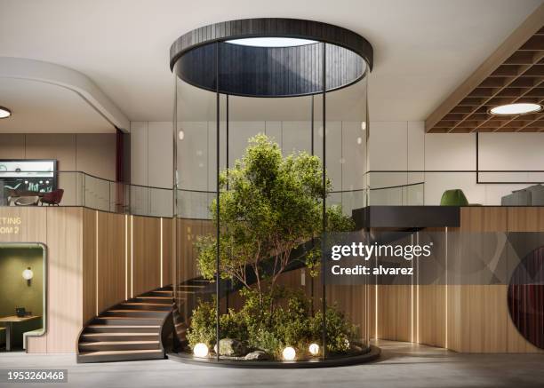 interno di un grande ufficio con scala a chiocciola - architettura ecologica foto e immagini stock