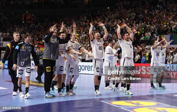 Players of Germany celebrate victory after the Men's EHF Euro 2024 main round match between Germany and Hungary at Lanxess Arena on January 22, 2024...