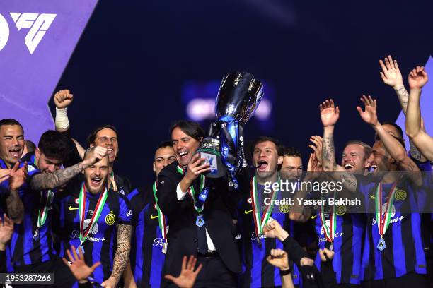 Simone Inzaghi, Head Coach of FC Internazionale, lifts the Italian EA Sports FC Supercup Final trophy at full-time following victory in the Italian...