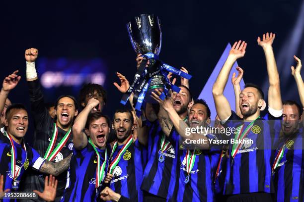 Hakan Calhanoglu of FC Internazionale lifts the Italian EA Sports FC Supercup Final trophy at full-time following victory in the Italian EA Sports FC...