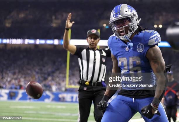 Jahmyr Gibbs of the Detroit Lions celebrates a touchdown against the Tampa Bay Buccaneers during a NFC Divisional Playoff game at Ford Field on...