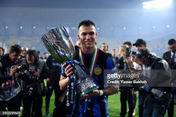 Lautaro Martinez of FC Internazionale poses for a photo with the Italian EA Sports FC Supercup Final trophy at full-time following victory in the...