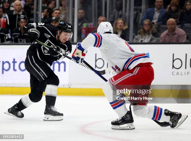 Jaret Anderson-Dolan of the Los Angeles Kings takes a shot in front of Jacob Trouba of the New York Rangers during a 2-1 win at Crypto.com Arena on...