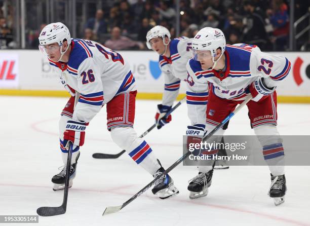 Jimmy Vesey and Adam Fox of the New York Rangers line up for a face-off during a 2-1 Los Angeles Kings win at Crypto.com Arena on January 20, 2024 in...