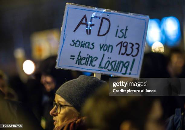 January 2024, Mecklenburg-Western Pomerania, Rostock: A participant in the demonstration against right-wing extremism under the motto "Never again is...