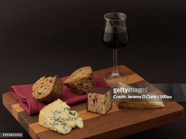 close-up of cheese and cheese on cutting board,united kingdom,uk - clark stock pictures, royalty-free photos & images