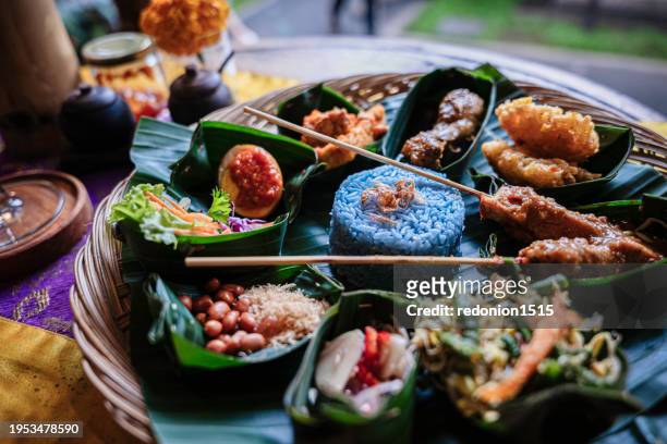 beautiful nasi campur in bali - balinese culture stock pictures, royalty-free photos & images