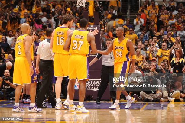 Derek Fisher, Pau Gasol, Ron Artest and Kobe Bryant of the Los Angeles Lakers celebrates against the Phoenix Suns in Game One of the Western...