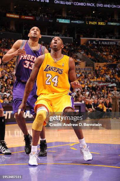 Kobe Bryant of the Los Angeles Lakers boxes out against Grant Hill#33 of the Phoenix Suns in Game One of the Western Conference Finals during the...