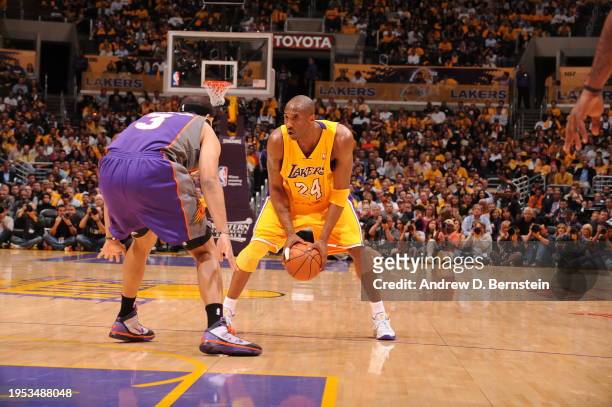 Kobe Bryant of the Los Angeles Lakers looks to drive against Jared Dudley of the Phoenix Suns in Game One of the Western Conference Finals during the...