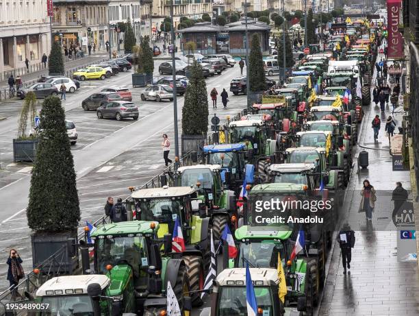 Breton farmers gather in a parking lot ahead of marching to the regional prefecture to protest the government's agricultural policy in Rennes, France...
