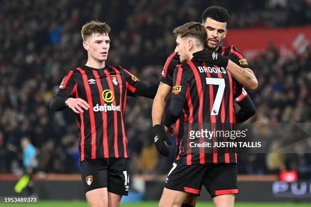 Bournemouth's English-born Welsh midfielder David Brooks celebrates with teammates after scoring their fourth goal during the English FA Cup fourth...