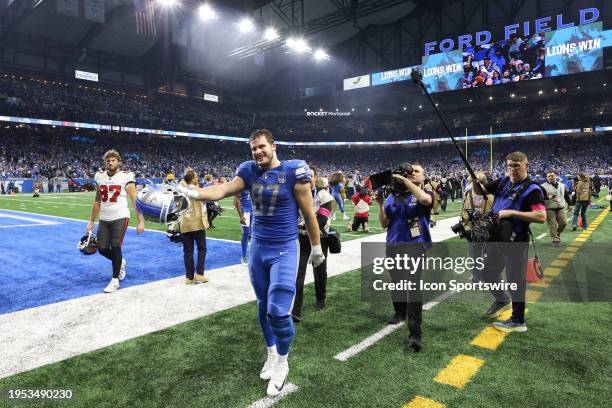 Detroit Lions tight end Sam LaPorta smiles as he leaves the field at the conclusion of an NFL NFC Divisional playoff football game between the Tampa...