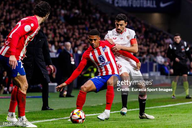 Jesús Navas of Sevilla fights for the ball with Samuel Lino of Atletico de Madrid during the Quarter Finals of Copa del Rey match between Atletico...